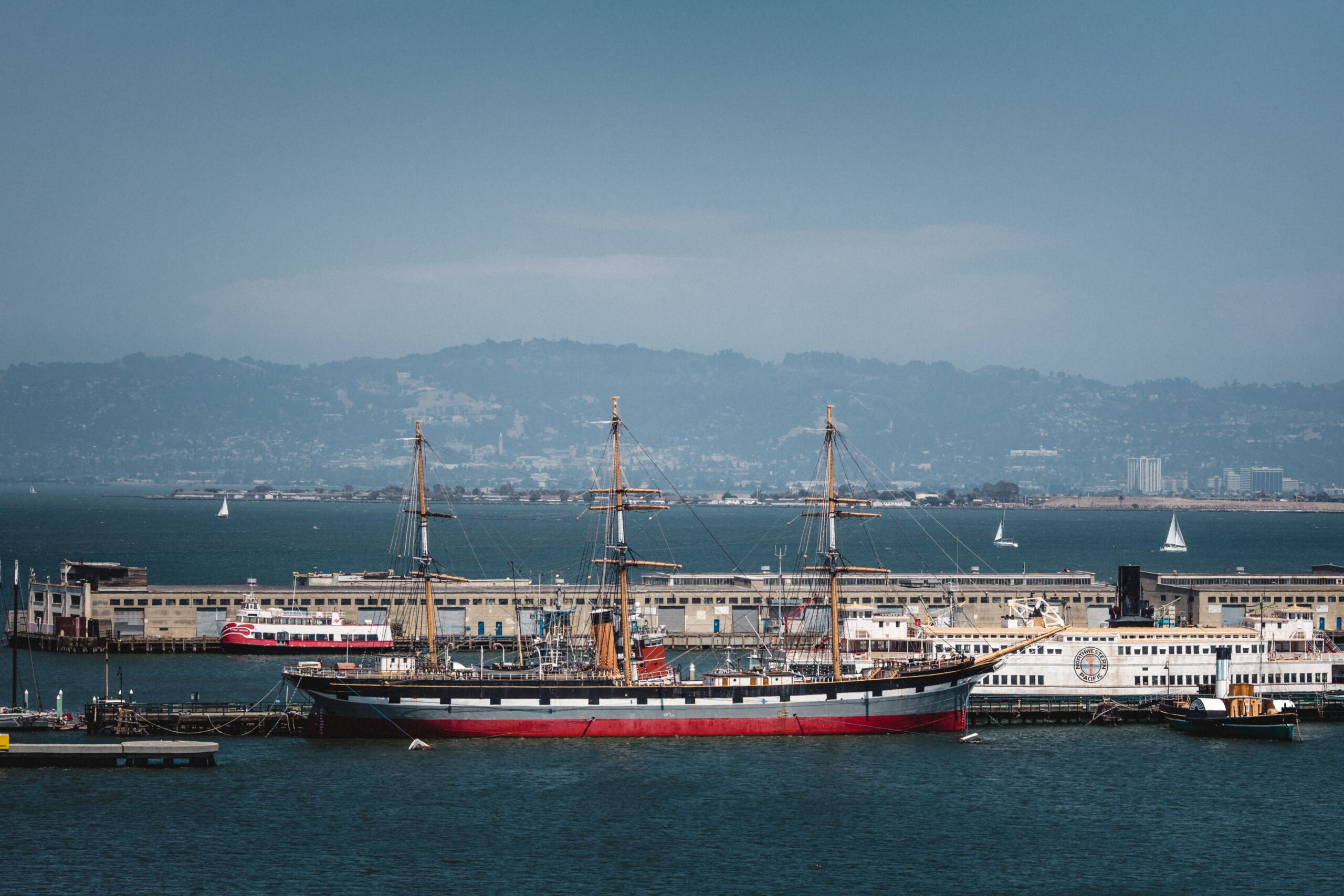 red-white-boat-sea-daytime-min